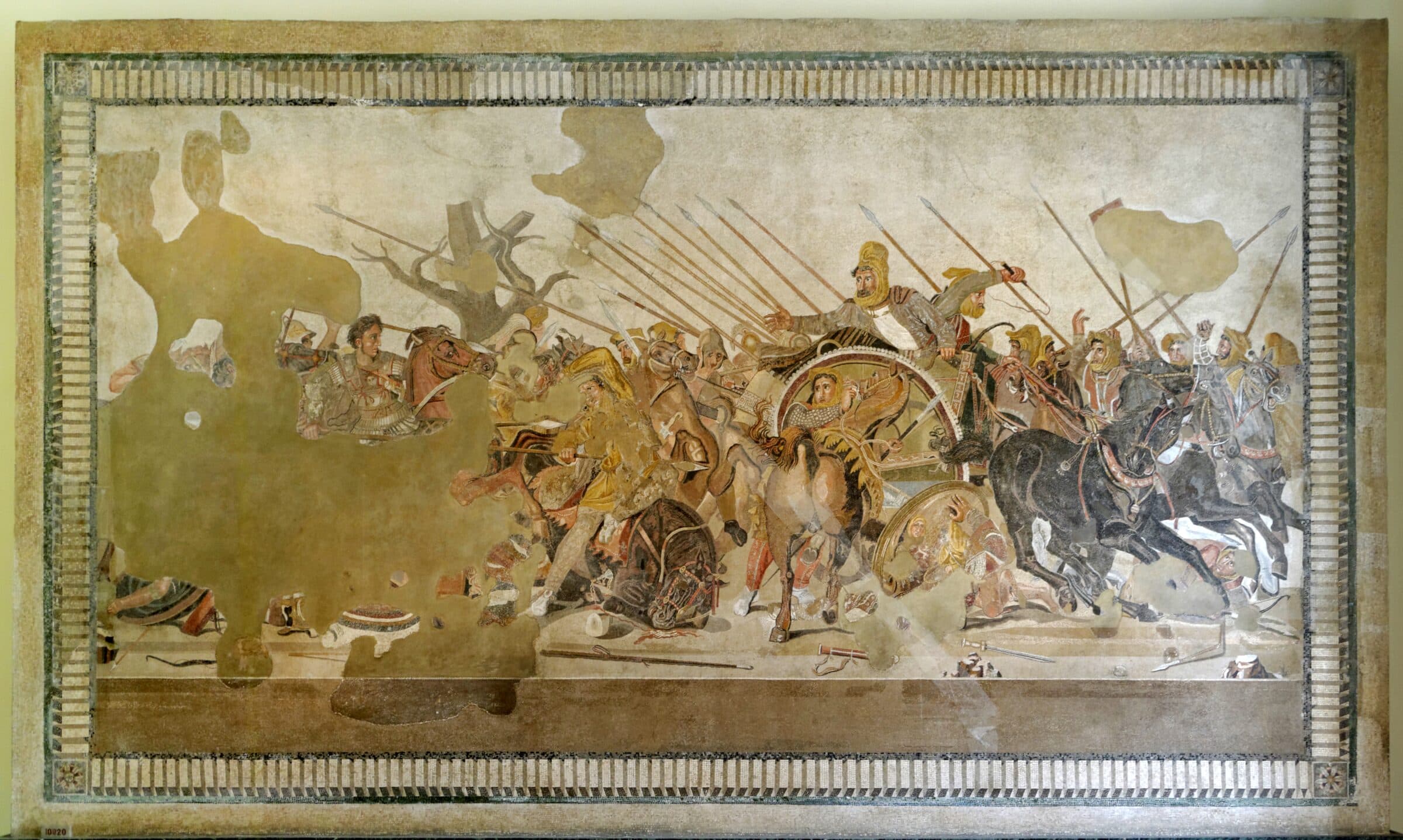 The Alexander Mosaic from the House of the Faun in Pompeii: Alexander charging on Bucephalus from the left, Darius III turning in his chariot on the right, under a forest of sarissas. The upper left of the floor is lost.